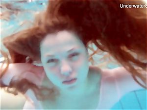ginger-haired Simonna showcasing her bod underwater